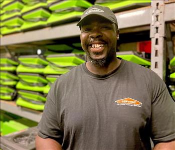 Man smiling with Servpro hat